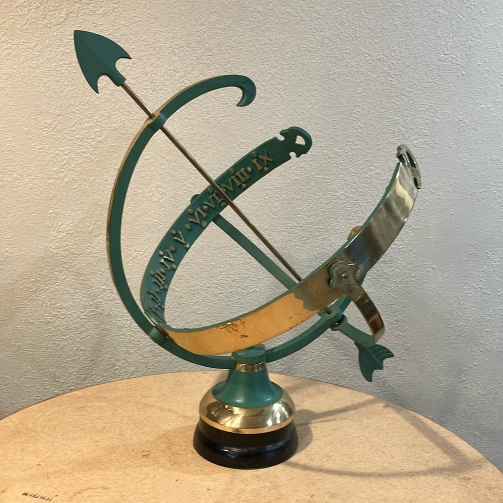 Home decor…heavy metal sphere with arrow.